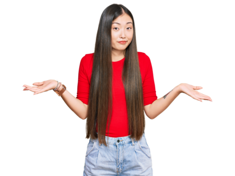 Young chinese woman wearing casual clothes clueless and confused expression with arms and hands raised. doubt concept.