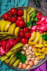 Assorted pickled vegetables on a large platter. top veiw