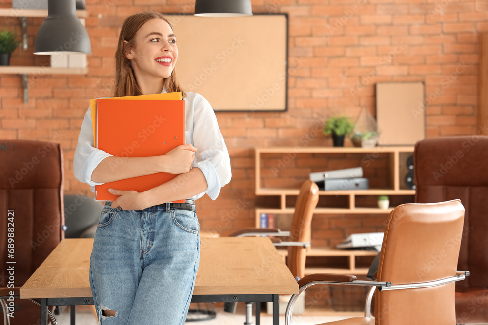 Poster Young businesswoman with document folders in office