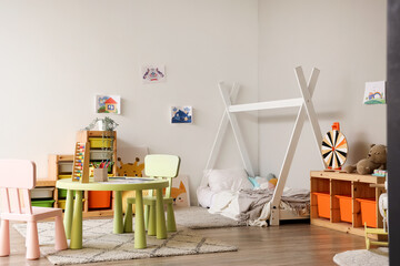 Interior of children's bedroom with bed and toys