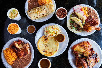 Composition of Mexican food in dishes. Enchilada, tacos, salsas