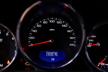 Dashboard of a modern sports car. Blue frame lights.