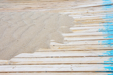 Sand on planked wood. Summer background with copy space. top view