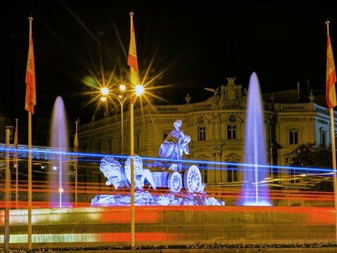A nice photo of the Plaza de la Cibeles in Madrid, Spain, illuminated with the colors of the Spanish flag, where Real Madrid celebrates its trophies.