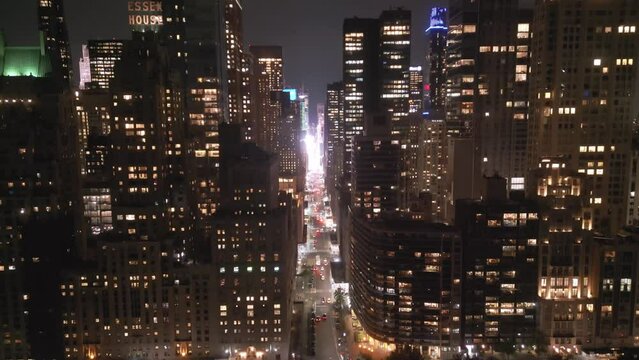 NY at night city lights. Night in Manhattan NYC. NY aerial view. New York City, Illuminated Manhattan view from drone. NY, Manhattan skyline. Night city scene NY, USA. Urban American Big City.