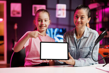 Daughter and mother being sponsored by partnering brand to do mockup tablet unboxing content....