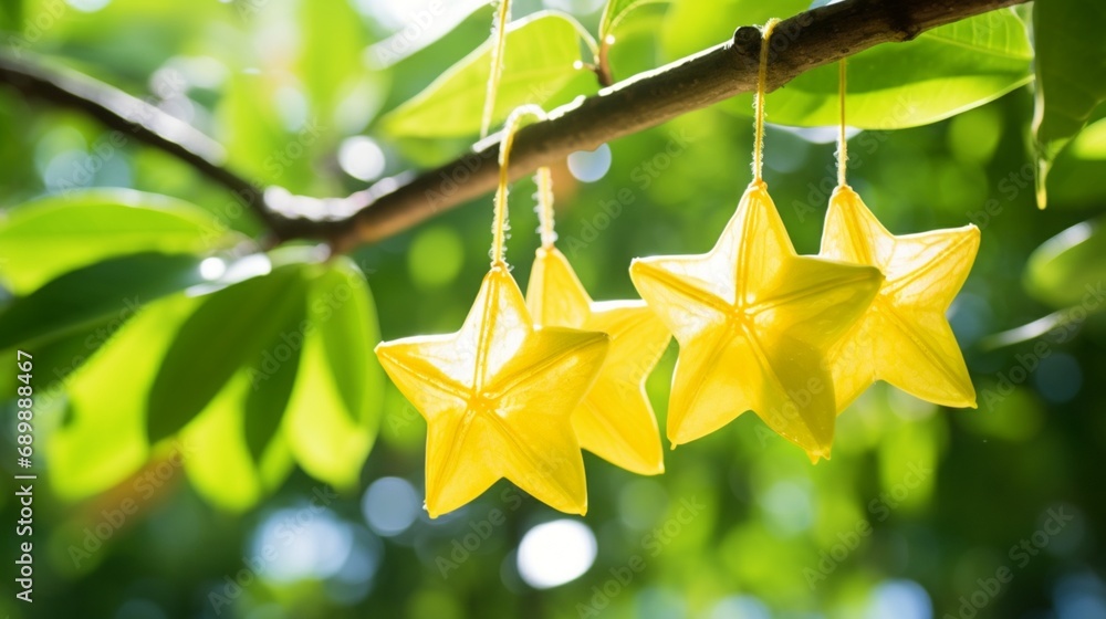 Poster a pair of star fruits with a defocussed natural backdrop hanging on a branch - ai generative