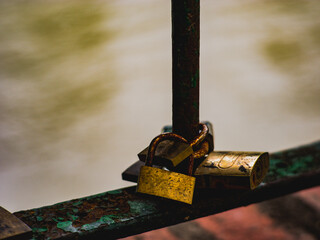 a padlock tied to a fence