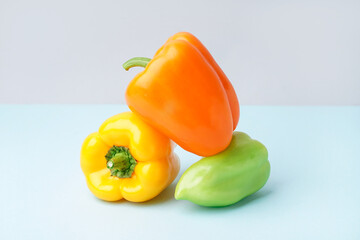 Fresh bell peppers on blue background