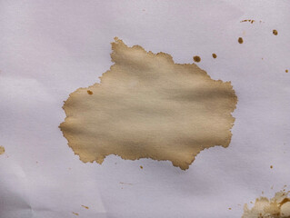 Abstract coffee grunge background. Brown coffee stains on white paper with copy space. Dirty paper with coffee drops. Coffee splash texture. Modern brown illustration.