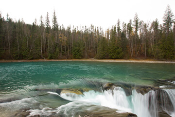 Blue and green Rearguard Falls in British Columbia in Canada