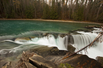 Green and blue Rearguard Falls in British Columbia in Canada