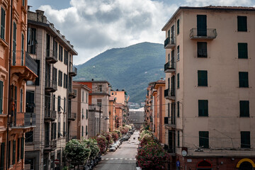 View of architecture and tree covered hills in La Spezia region of Italy