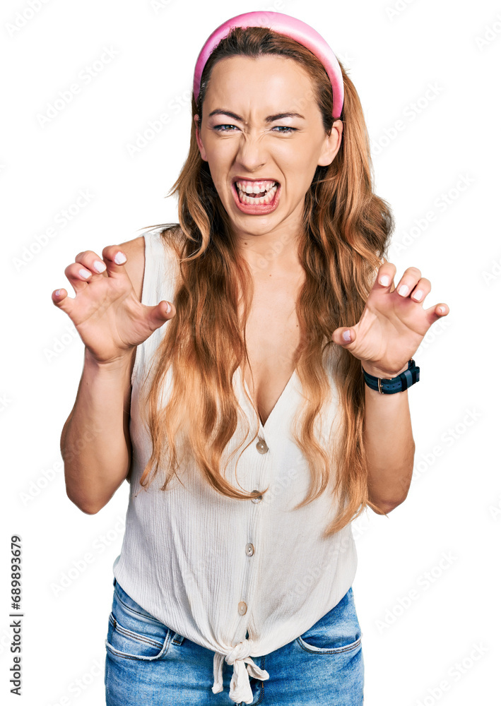 Sticker young caucasian woman wearing casual style with sleeveless shirt smiling funny doing claw gesture as