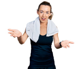 Young caucasian woman wearing sportswear and towel smiling cheerful offering hands giving assistance and acceptance.