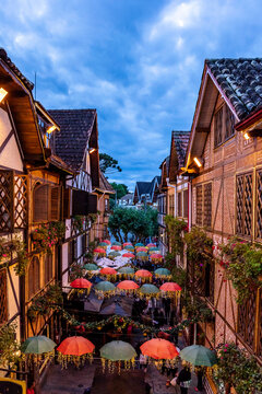 Swiss architecture in Campos do Jord&atilde;o. Street with umbrella decorating cold tourist city of Sao Paulo at Christmas time in Brazil, window view