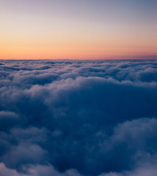 Clouds and sky. Aerial above clouds.
Aerial shot revealing the sun above the clouds.