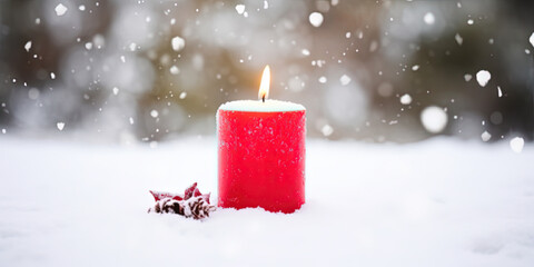 Christmas candle in the snow with copy space