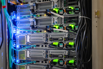Powerful web servers are located in the racks of a modern data center.