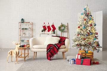 Interior of stylish living room with beautiful Christmas tree