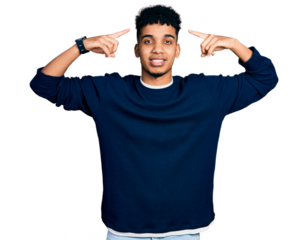 Young african american man wearing casual clothes smiling pointing to head with both hands finger, great idea or thought, good memory