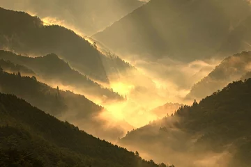 Fotobehang sunrise over the mountains © hiroshi