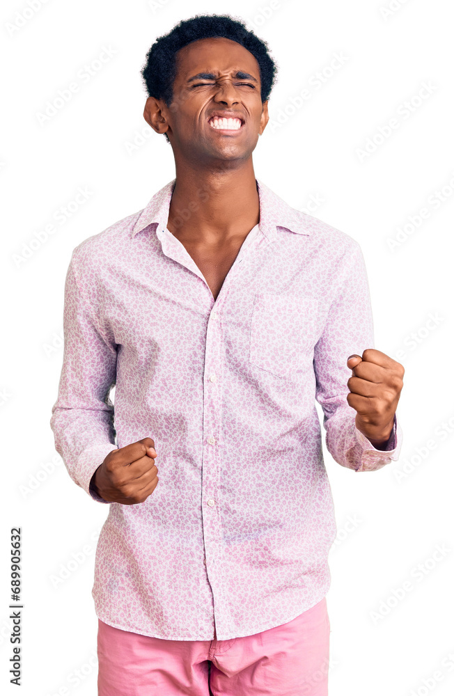 Canvas Prints African handsome man wearing casual pink shirt very happy and excited doing winner gesture with arms raised, smiling and screaming for success. celebration concept.