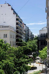 Panoramic view of some buildings among trees. 