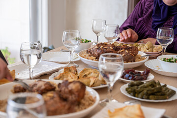 Family eating together with multi generation members in modern living room