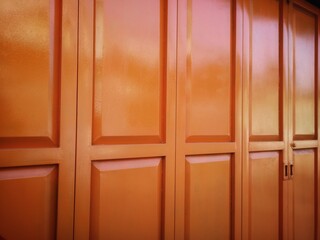 Orange folding door. The folding door of a parking room