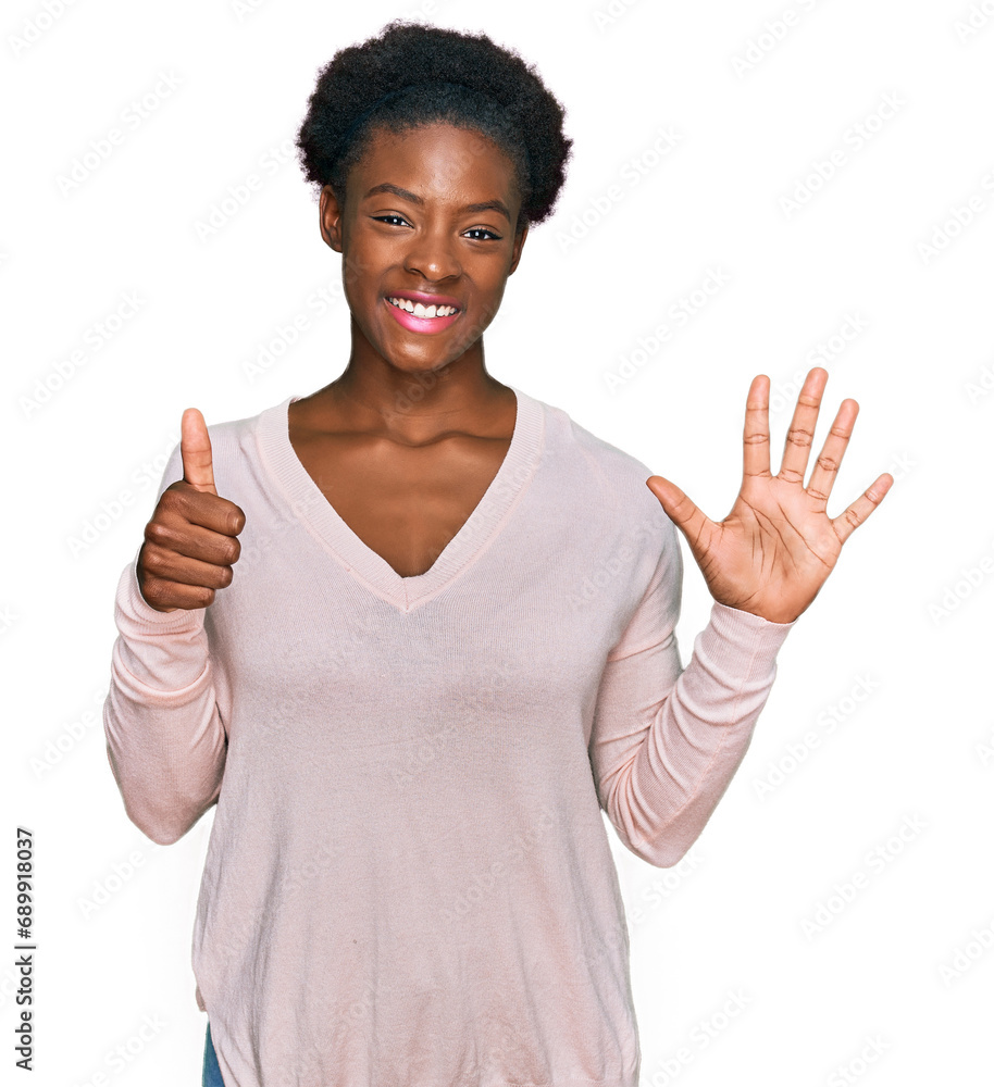 Sticker young african american girl wearing casual clothes showing and pointing up with fingers number six w