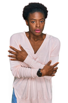 Young african american girl wearing casual clothes shaking and freezing for winter cold with sad and shock expression on face