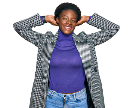 Young african american girl wearing casual clothes relaxing and stretching, arms and hands behind head and neck smiling happy