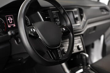 View of steering wheel and dashboard inside of modern car