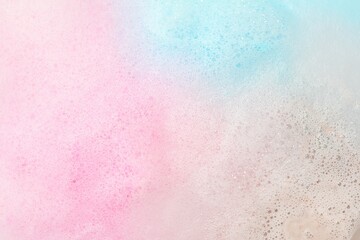 Colorful foam after dissolving bath bomb in water, closeup - obrazy, fototapety, plakaty