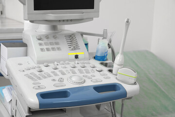 Ultrasound machine near white wall in hospital, closeup