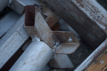 Close up of old rusty metal pipe in construction site. Selective focus.