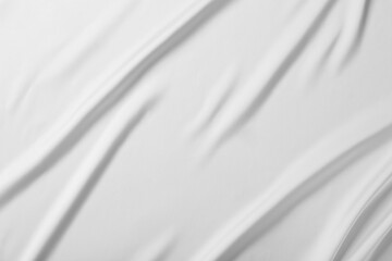 Fototapeta na wymiar Texture of white silk ripple fabric as background, top view