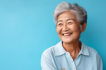 Portrait of a happy smiling asian senior woman. High quality photo - obrazy, fototapety, plakaty