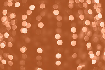 Peach Fuzz lights bokeh background, Chrismas lights bokeh. Monochrome abstract background. Blurred and glowing lights. Classic blue bokeh lens effect from lighting spots.