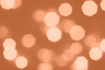 Peach Fuzz lights bokeh background, Chrismas lights bokeh. Monochrome abstract background. Blurred and glowing lights. Classic blue bokeh lens effect from lighting spots.