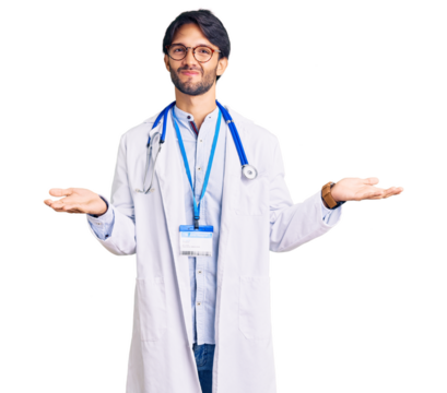 Handsome hispanic man wearing doctor uniform and stethoscope clueless and confused expression with arms and hands raised. doubt concept.