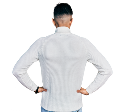Young arab man with beard wearing elegant turtleneck sweater and glasses standing backwards looking away with arms on body