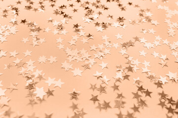 Abstract stars background, toned in trendy color of the year 2024 Peach Fuzz