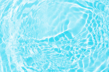 Bluewater bubbles on the surface ripples. Defocus blurred transparent white-black colored clear calm water surface texture with splash and bubbles. Water waves with shining pattern texture background.