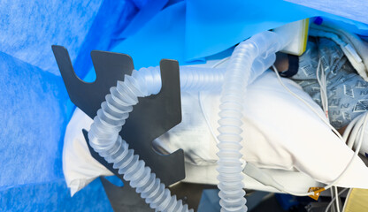 Modern hospital anesthesia machine with intricate ventilation tubing, essential for medical...