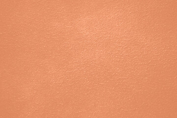 Peach Fuzz toned colour grunge decorative wall background. Art rough stylized texture banner trendy color 2024. Grunge Peach Fuzz color texture