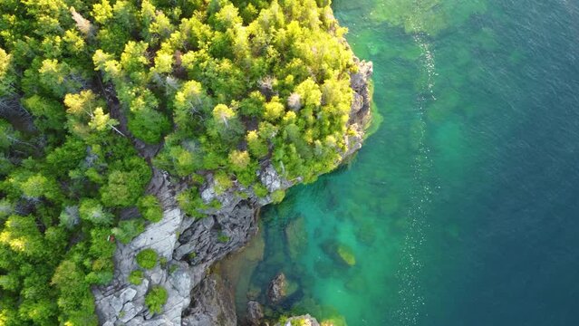 Descending On Eroded Rock Cliffs In Georgian Bay Islands National Park, Ontario, Canada. Aerial Drone Shot