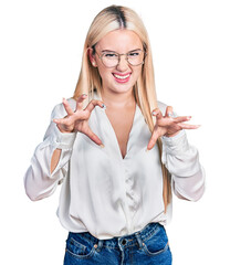 Beautiful blonde woman wearing elegant shirt and glasses smiling funny doing claw gesture as cat,...
