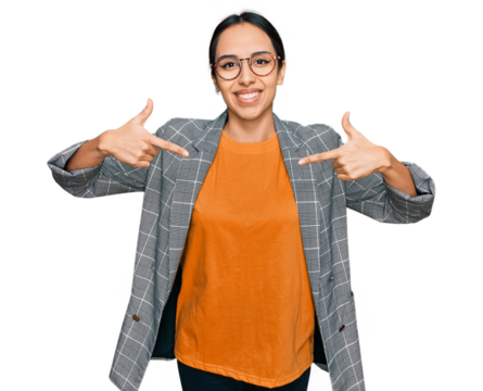 Young hispanic girl wearing business jacket and glasses looking confident with smile on face, pointing oneself with fingers proud and happy.